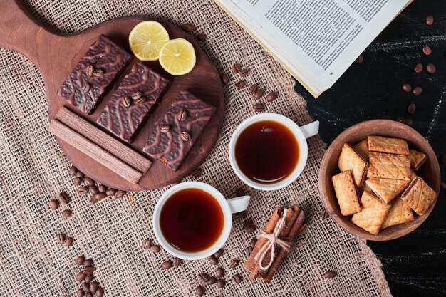 Crackers and chocolate waffles with tea