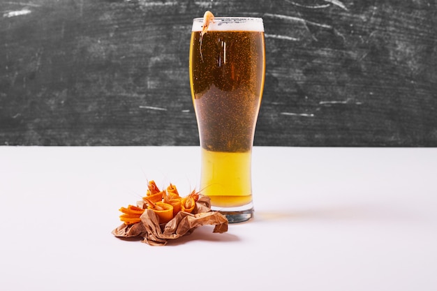 Crackers with beer on white.