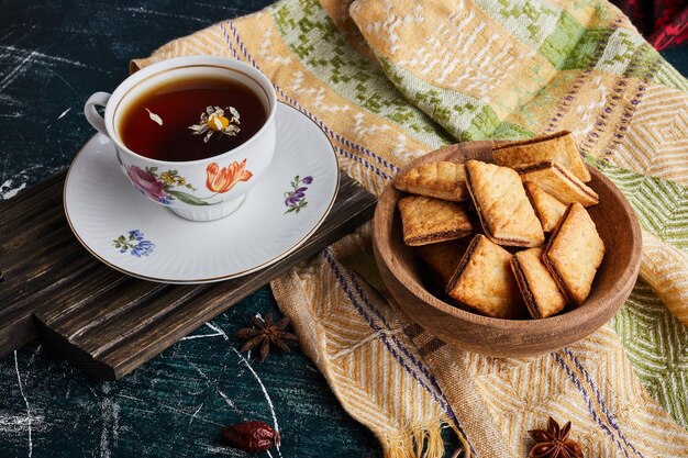 Crackers with a cup of herbal tea. 
