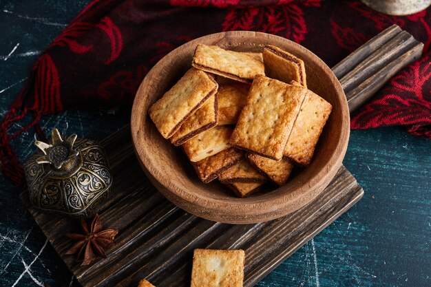 Crackers on a wooden cup. 