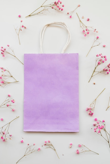 Free photo craft packet between flower twigs