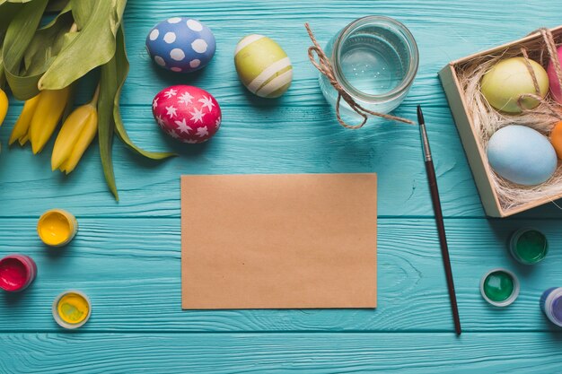 Craft paper near eggs and tulips