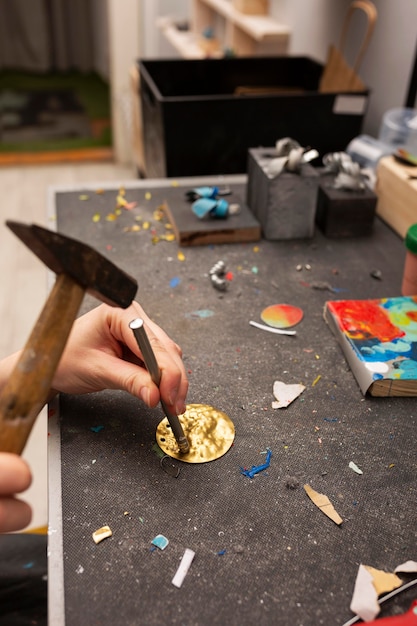 Free photo crafting in golden piece of metal