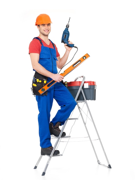 Free photo craftsman with tools  with stairs , full portrait over white background