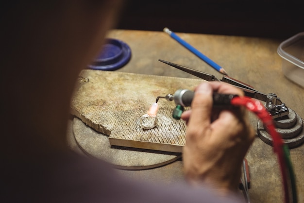 Craftswoman using blow torch