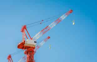 Free photo crane and building construction site