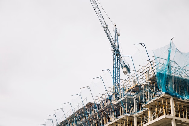 Free photo crane and building under construction