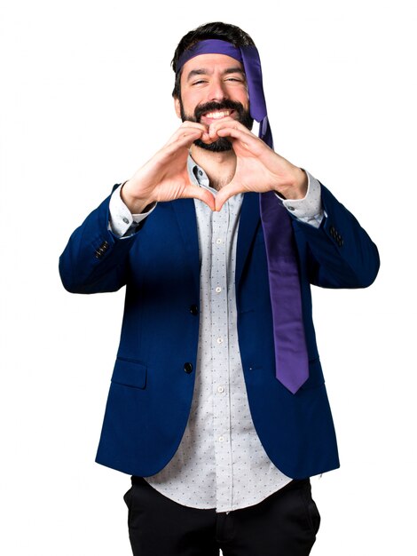 Crazy and drunk businessman making a heart with his hands