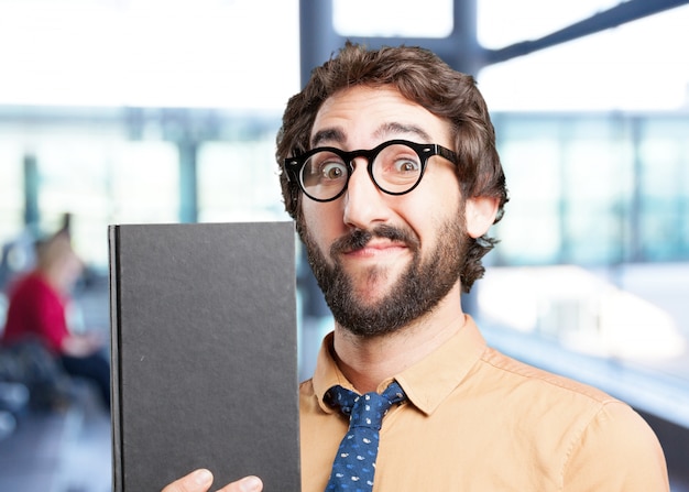 Free photo crazy man with book.funny expression