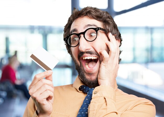 crazy man with credit card.funny expression