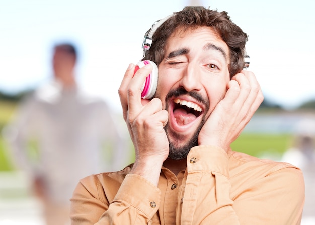 crazy man with headphones.funny expression