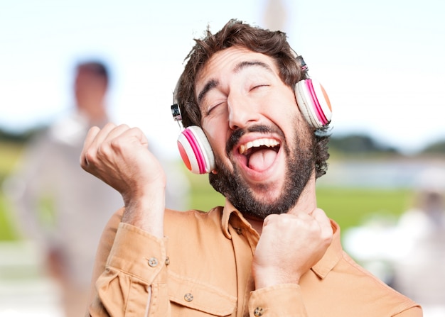 Free photo crazy man with headphones.funny expression