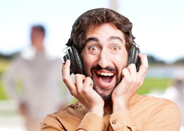 crazy man with headphones.funny expression