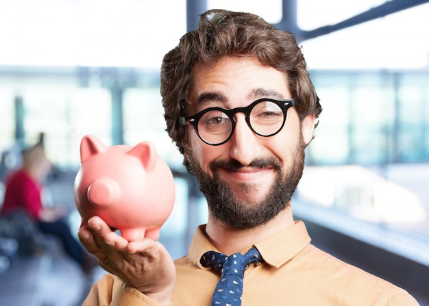 Free photo crazy man with piggy bank.funny expression