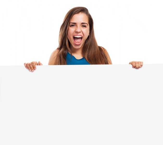 Crazy teenager holding a blank billboard