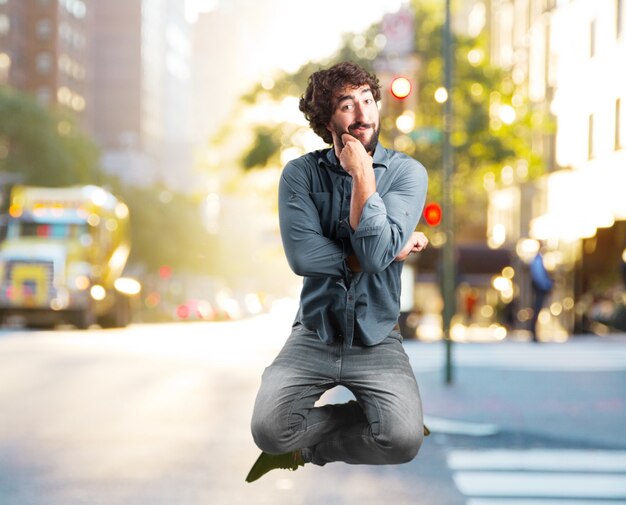 Free photo crazy young man jumping. happy expression