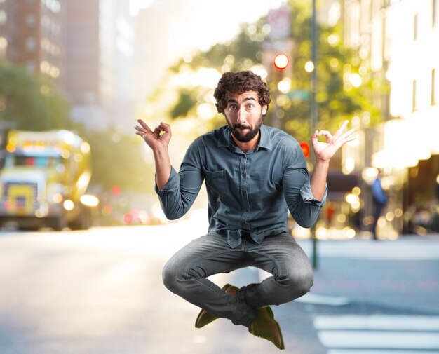 crazy young man jumping. happy expression