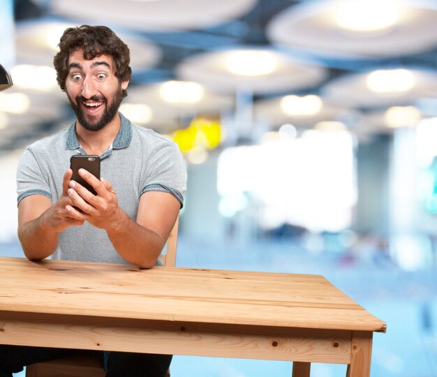 crazy young man with table .happy expression