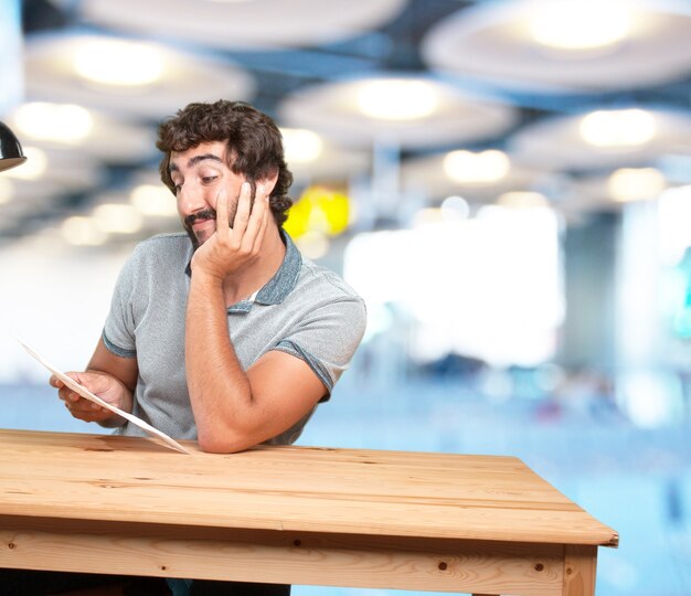 crazy young man with table .happy expression