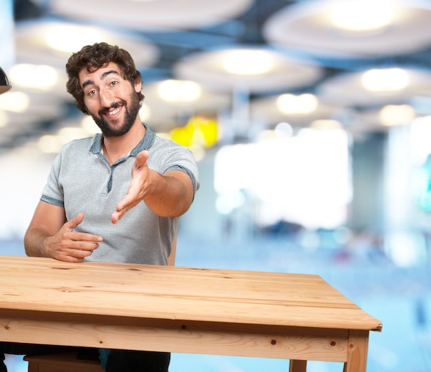 crazy young man with table .happy expression