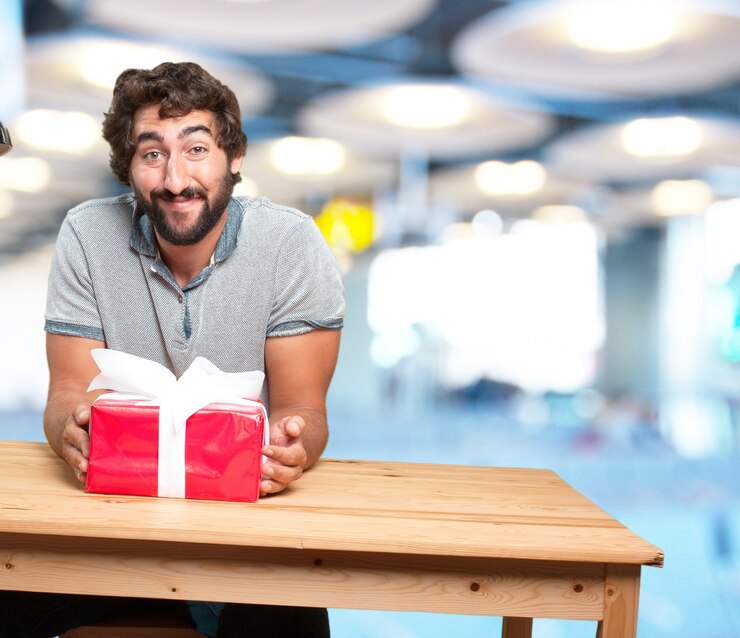 Free Photo crazy young man with table .happy expression