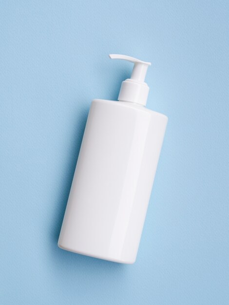 Cream bottle mock-up on blue background