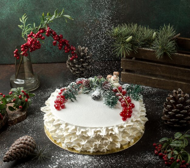 cream cake with cranberries on the table