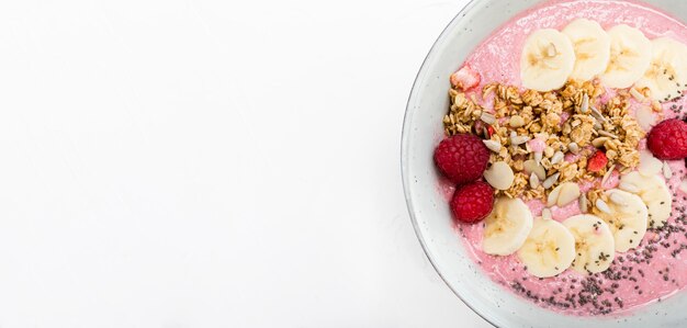 Cream of fruit with raspberry and banana copy space