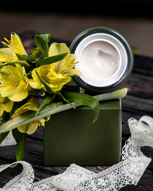 Cream with flower on the table