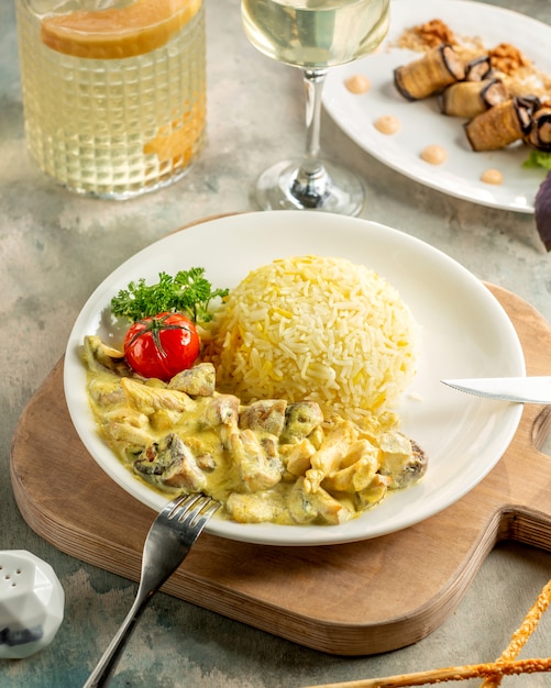 Creamy chicken and mushroom sauteed served with rice and vegetables