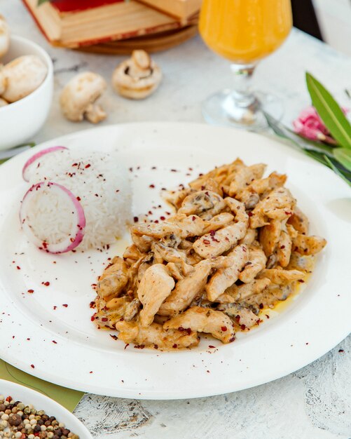 Creamy chicken and mushroom served with rice