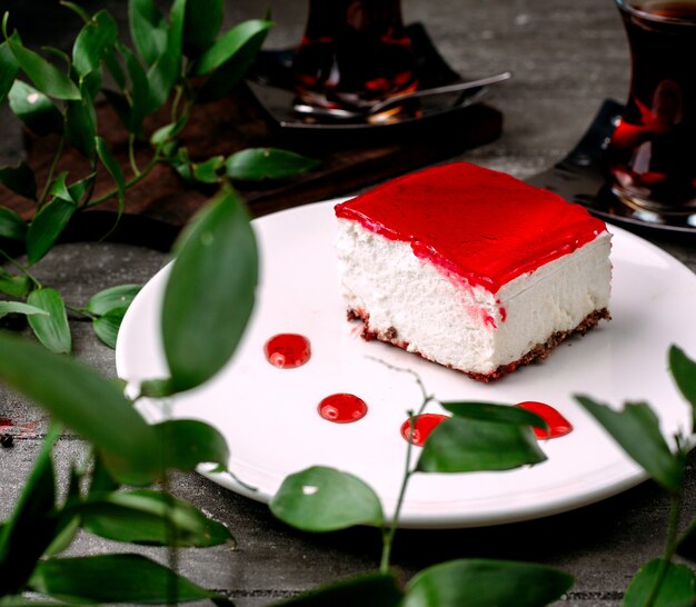 Creamy dessert with red jam on top