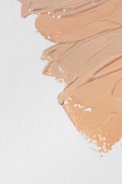 Creamy foundation advertising flat lay