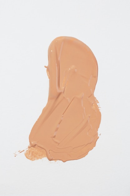 Creamy foundation  on white background above view