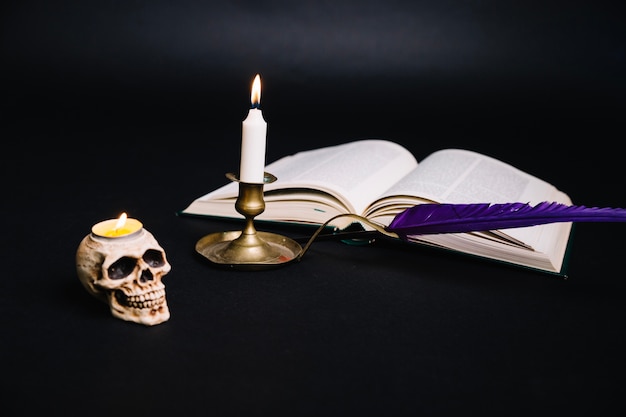 Free photo creative arrangement of book and candlestick