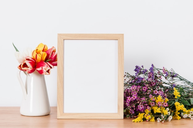 Creative arrangement of frame and flowers