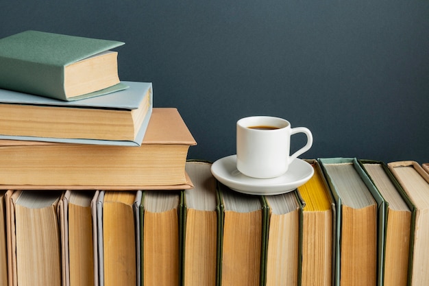 Creative arrangement with different books and coffee