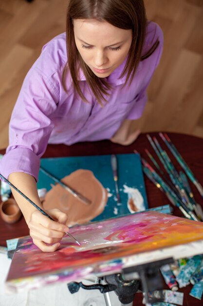 Creative artist painting in the studio