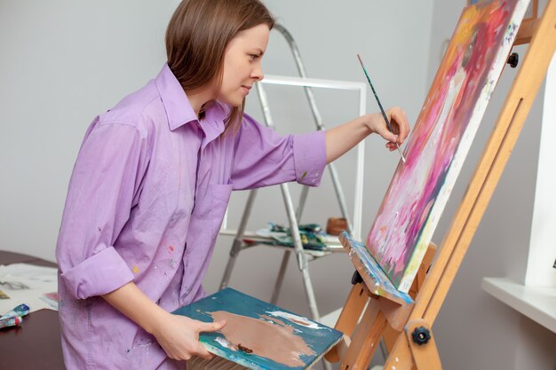 Creative artist painting in the studio