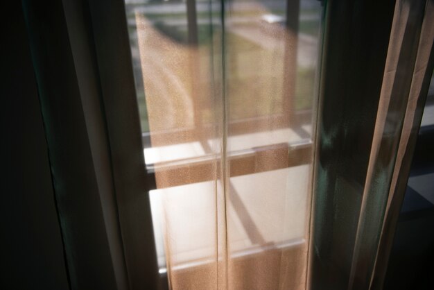 Creative background with curtain and shadow from window