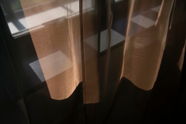 Free photo creative background with curtain and shadow from window