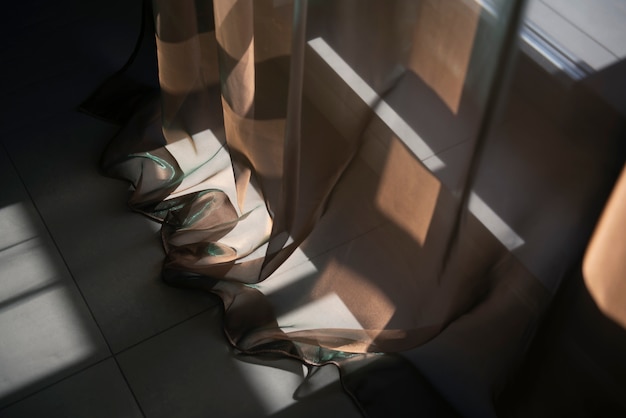 Creative background with curtain and shadow from window