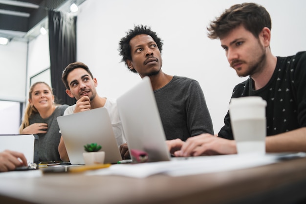 Creative business people listening to colleague