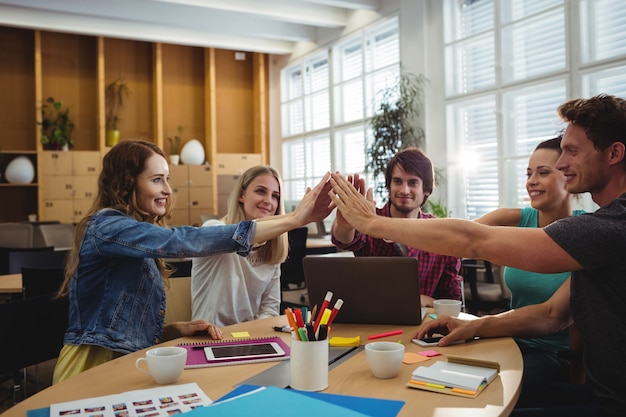 Free photo creative business team putting hands together