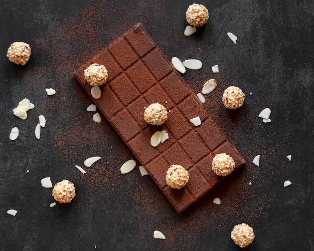 Creative chocolate composition on dark background