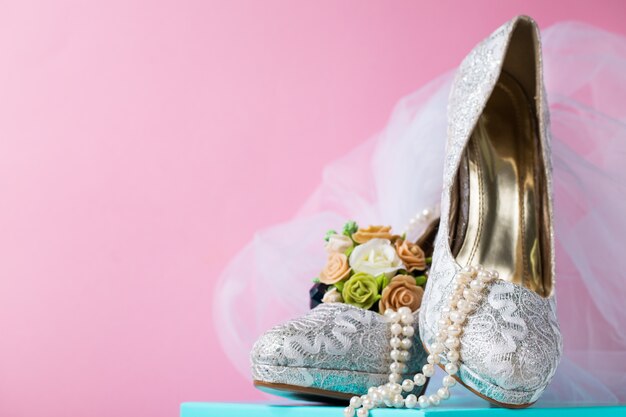 Creative composition of bridal lace shoes