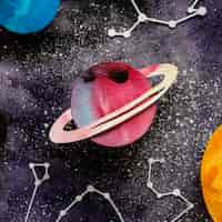 Free photo creative composition of paper planets