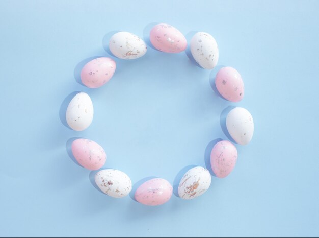 Creative copy space pattern made of pastel easter eggs nature flat lay easter concept