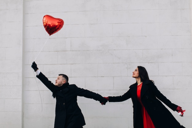 Creative couple with red balloon