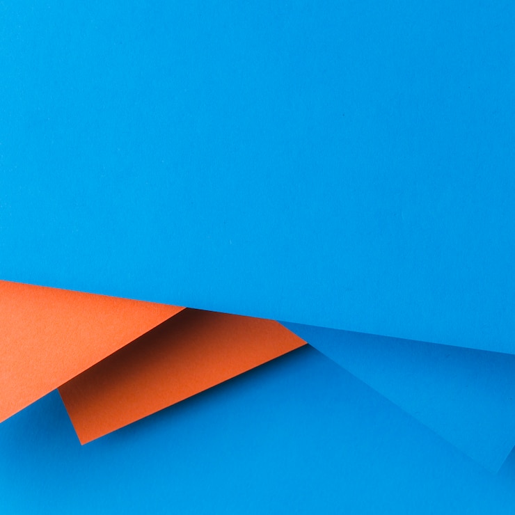 Free Photo creative design made with blue and an orange paper